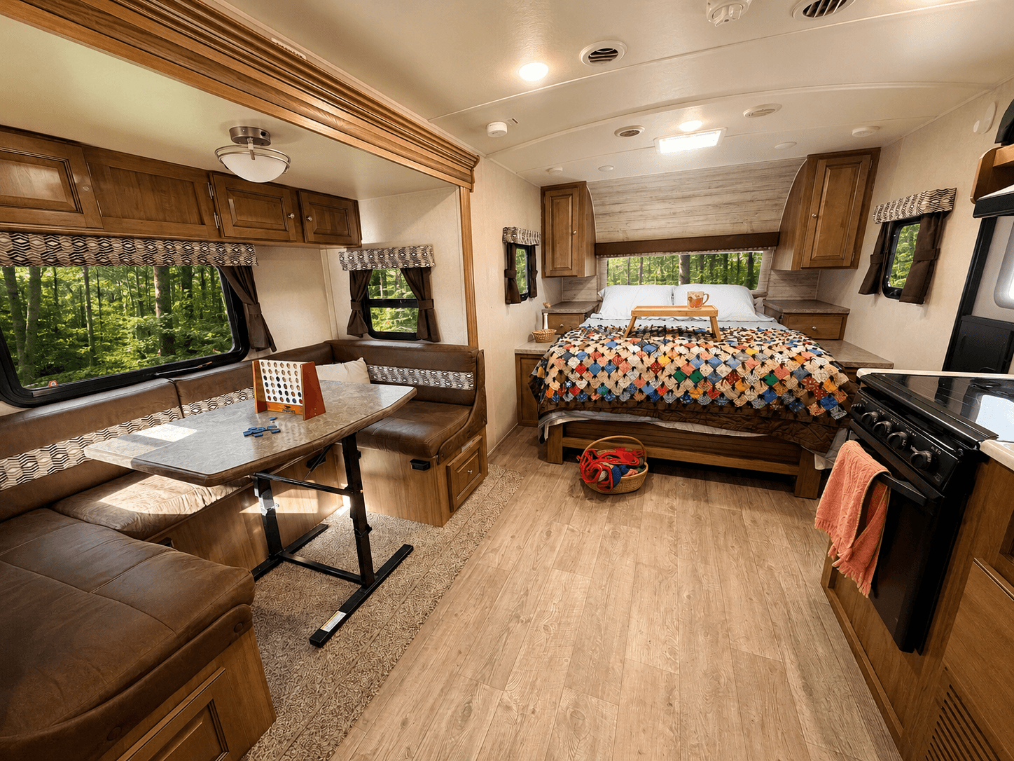 Freshly made bed with a colorful quilt inside Cherry Cottage